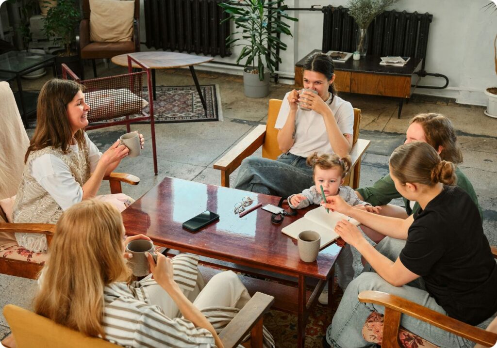 Parents and children gathered in conversation, sharing ideas and connection